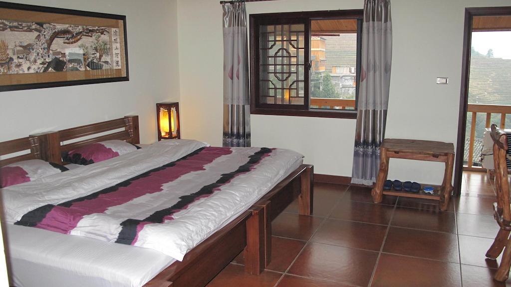 Longji Holiday Hotel Longsheng Quarto foto